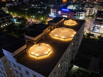 Atrium tensile roof with three illuminated conical canopies at KBN Hospital, Gulbarga, Karnataka