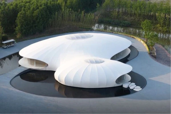 ShadeCo auditorium tensile structures, a lightweight, eco-friendly canopy offering stylish weather protection and comfort for school or mall auditoriums.