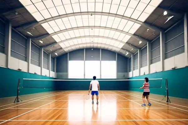 ShadeCo badminton court shade, a durable and customizable tensile canopy providing cost-effective roofing for indoor or outdoor sports facilities.