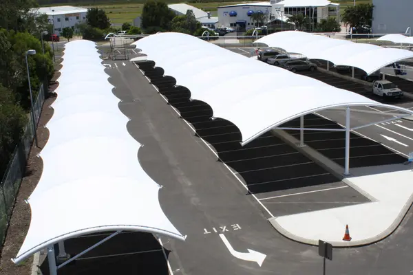 ShadeCo cantilever shade structure, a stylish and durable tensile canopy providing custom shade for commercial, residential, or public outdoor spaces.