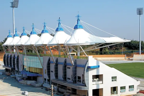 ShadeCo stadium tensile structure, a robust, eco-friendly canopy providing stylish shade and shelter for sports arenas and spectators.