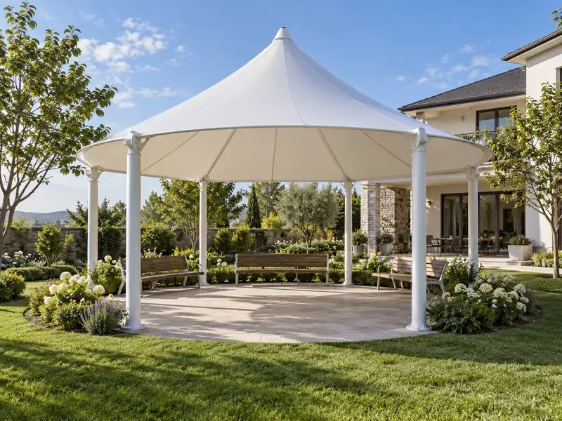 White circular conical gazebo with seating in a residential garden