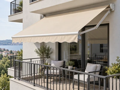 Cream retractable awning shading an apartment balcony