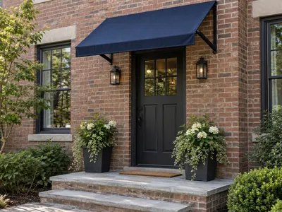 Navy blue awning over a brick building entrance