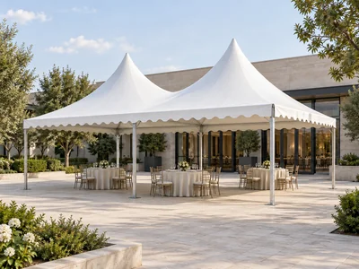 White double peak pagoda tent with scalloped frill and outdoor event seating