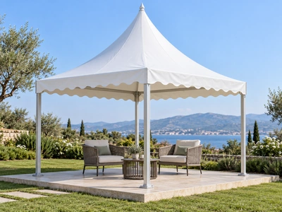 Open white pagoda gazebo with two armchairs and a table in a garden