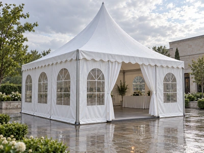 White pagoda tent with fitted sidewalls and clear windows after rain