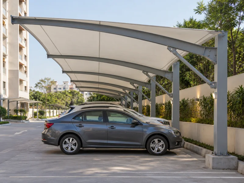 White cantilever canopy sheltering parked cars