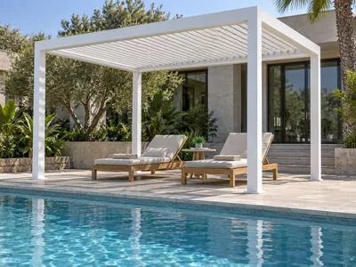 White poolside pergola with a slatted roof shading two sun loungers