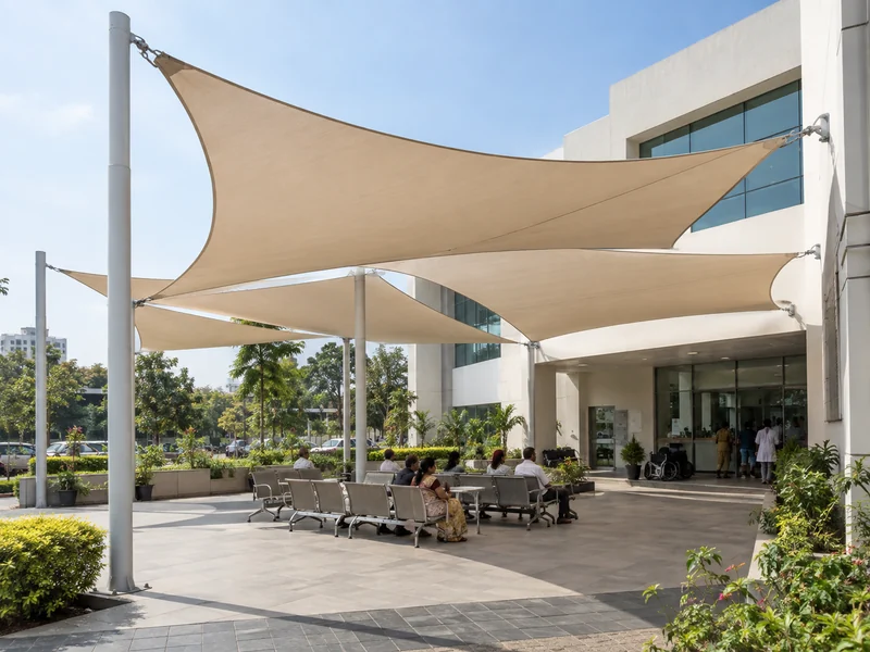 Large multi-sail layout over a hospital waiting area with posts placed clear of the entrance