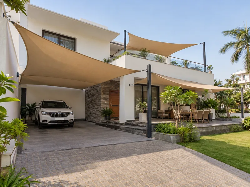 Villa with shade sails over the car spot, patio and terrace, each fixed to walls and posts