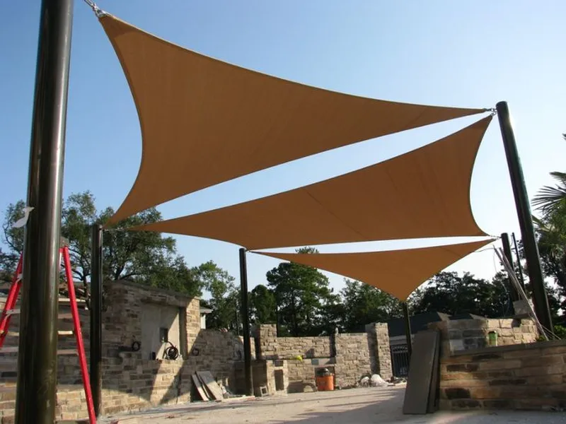 Modern tensile shade sail installation for commercial outdoor space