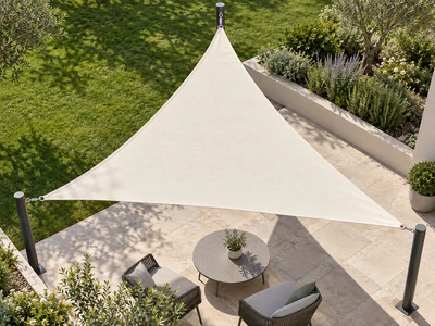 A triangular ivory shade sail anchored to three dark steel posts above seating