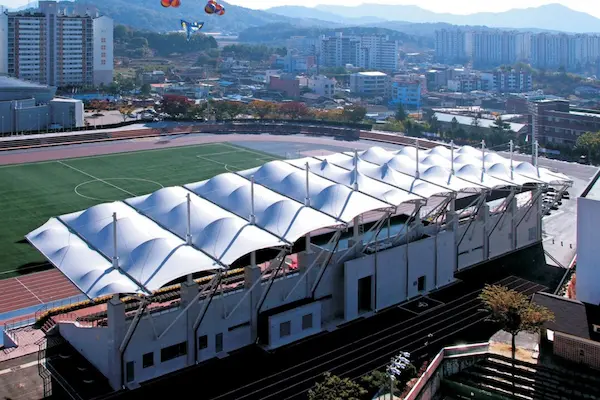 Stadium tensile roof structure by ShadeCo for large sports arena coverage