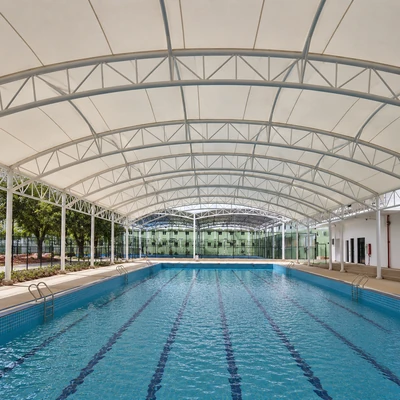 Swimming pool shade structure designed for sun protection and user comfort