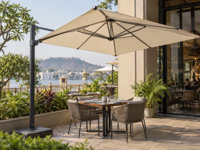 Side-post tensile umbrella shading a four-seater table on a restaurant patio