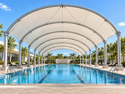 Swimming pool sun sheds by ShadeCo India for pool shade in homes hotels resorts clubs and farmhouses