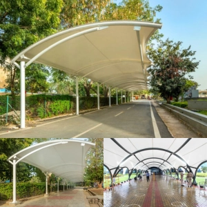Walkway shade structures with tensile fabric roofing systems