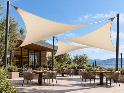 Architectural concept of tensioned fabric shade sails over a restaurant outdoor seating area