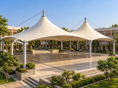 Architectural concept of twin-peaked tensile membrane roofs over an open school courtyard